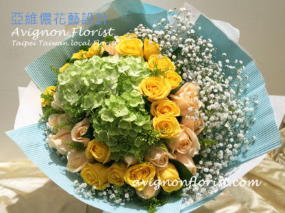 Hydrangea with yellow and Champagne roses