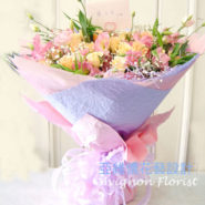 Champagne Roses Bouquet020009 A bouquet of champagne colored roses wrapped in paper