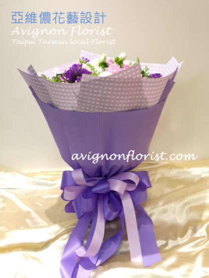 a bouquet of purple roses