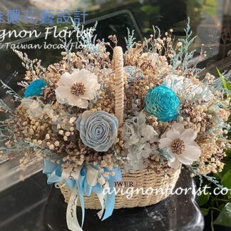 A dried flower basket featuring soft blue and brown tones with a calm, natural look.