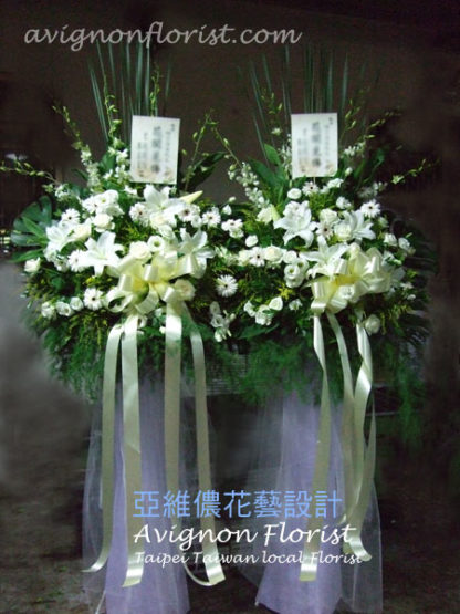 A pair of sympathy flower arrangements