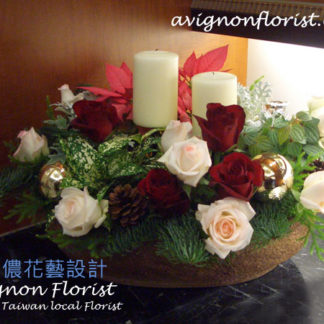 Roses and Poinsettias with candles for Christmas in Taipei