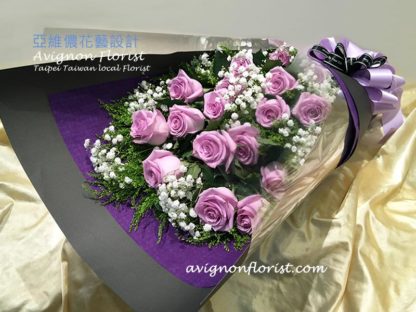 Purple Roses in bouquet