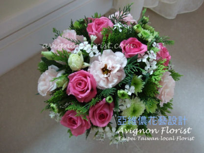 Pink roses and pink lisianthus with greenery and flowers